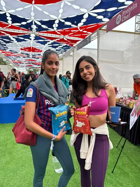 Players holding Poptein packs on court