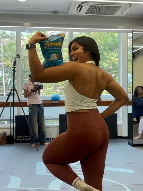 Athlete holding a Poptein pack after training